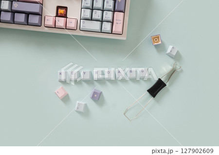 Concept cleaning and customization keycaps in modern mechanical keyboard on blue background. Custom build keyboard keycap. View from above, 127902609