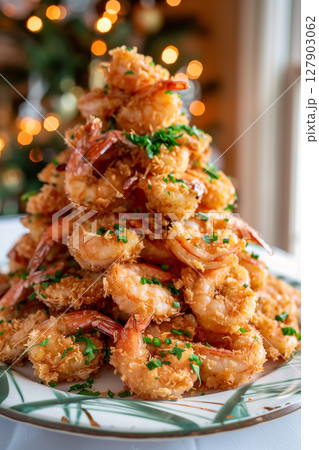 A festive plate of crunchy breaded fried shrimp shaped like a christmas tree A festive plate of crunchy breaded fried shrimp shaped like a christmas tree 127903062