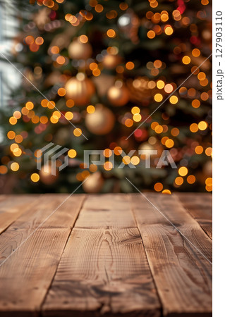 Cozy scene with empty table in front of a beautifully decorated christmas tree 127903110