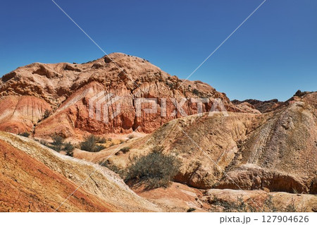 Red canyon and clear blue sky, natural landscape. 127904626
