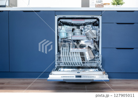 Dishwasher in modern blue kitchen 127905011