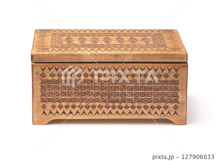 Front view of old wooden carved casket Front view of old wooden carved casket 127906833