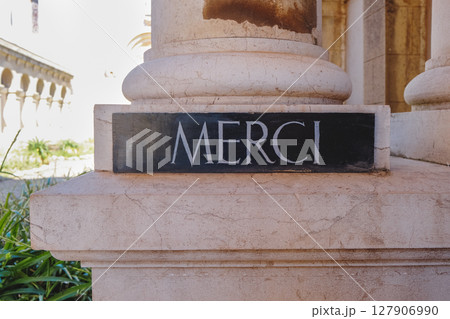 sign with the word merci at Lerins Abbey, France 127906990