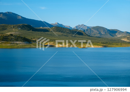 Iznajar reservoir and olive groves in southern Spain Iznajar reservoir and olive groves in southern Spain 127906994