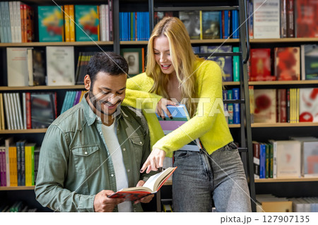Long-haired blonde woman and dark-haired man at the library 127907135