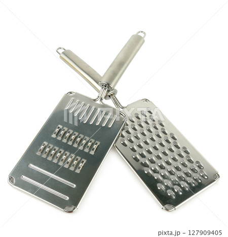 Set of graters isolated on white background, top view. Set of graters isolated on white background, top view. 127909405