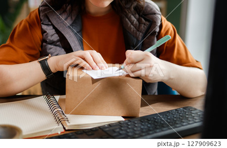 Woman working in a warehouse 127909623