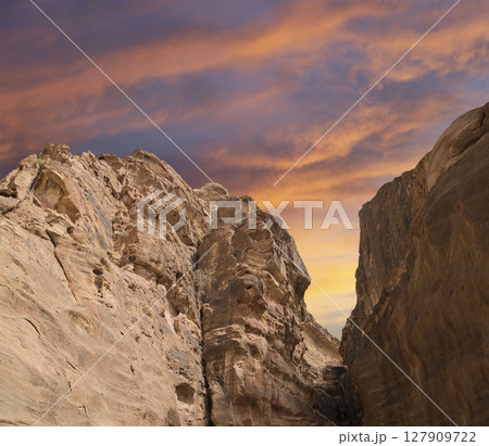Mountains of Petra (against the background of a beautiful sky with clouds), Jordan, Middle East. Petra has been a UNESCO World Heritage Site since 1985 Mountains of Petra (against the background of a beautiful sky with clouds), Jordan, Middle East. Petra has been a UNESCO World Heritage Site since 1985 127909722
