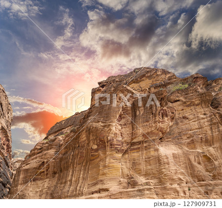 Mountains of Petra (against the background of a beautiful sky with clouds), Jordan, Middle East. Petra has been a UNESCO World Heritage Site since 1985 Mountains of Petra (against the background of a beautiful sky with clouds), Jordan, Middle East. Petra has been a UNESCO World Heritage Site since 1985 127909731
