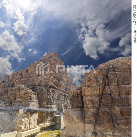 Mountains of Petra (against the background of a beautiful sky with clouds), Jordan, Middle East. Petra has been a UNESCO World Heritage Site since 1985 127909732