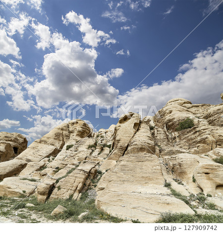 Mountains of Petra (against the background of a beautiful sky with clouds), Jordan, Middle East. Petra has been a UNESCO World Heritage Site since 1985 127909742