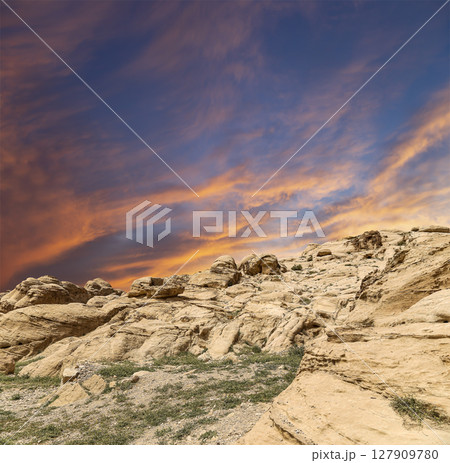 Mountains of Petra (against the background of a beautiful sky with clouds), Jordan, Middle East. Petra has been a UNESCO World Heritage Site since 1985 127909780