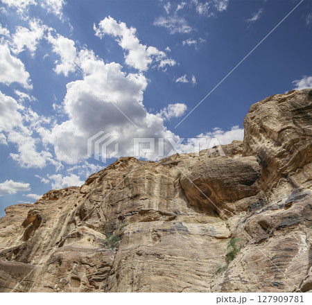 Mountains of Petra (against the background of a beautiful sky with clouds), Jordan, Middle East. Petra has been a UNESCO World Heritage Site since 1985 Mountains of Petra (against the background of a beautiful sky with clouds), Jordan, Middle East. Petra has been a UNESCO World Heritage Site since 1985 127909781
