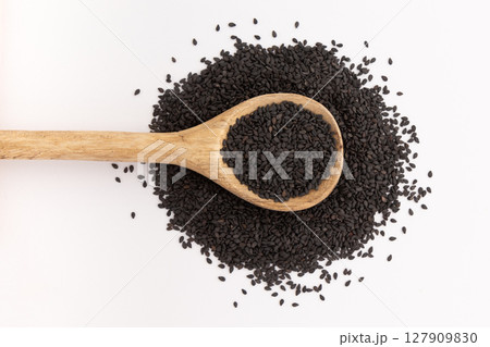 black sesame in spoon isolated 127909830