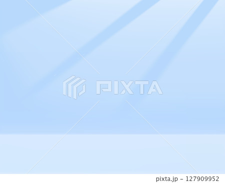 Clean white limbo background with soft blue gradient lighting - minimalist empty studio space for product photography, professional backdrop and commercial shooting environment with subtle shadows. 127909952