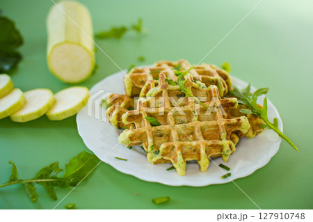 Crispy vegetable waffles served with herbs Crispy vegetable waffles served with herbs 127910748