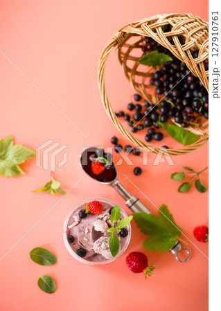 Berry ice cream with natural ingredients on background 127910761
