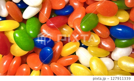 background of colorful chocolate candies jelly beans pink, yellow and green 127911339
