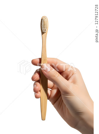 Sustainable bamboo toothbrush in hand, zero-waste lifestyle product mockup Sustainable bamboo toothbrush in hand, zero-waste lifestyle product mockup 127912728