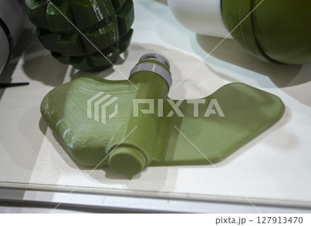 Mina Petal printed on 3D printer. Anti-personnel explosive mine created on 3D printer from molten plastic. Prototype of ammunition printed on 3D printer. Innovation modern new 3d printing technology Mina Petal printed on 3D printer. Anti-personnel explosive mine created on 3D printer from molten plastic. Prototype of ammunition printed on 3D printer. Innovation modern new 3d printing technology 127913470