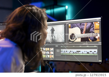 Video editor showcasing experience with 3D special effects and editing software packages, taking footage shot by production teams and improving it. Videographer finishing project in studio Video editor showcasing experience with 3D special effects and editing software packages, taking footage shot by production teams and improving it. Videographer finishing project in studio 127913915