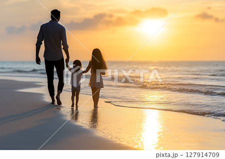 Family Enjoying Fun Times Together During Summer Vacation at the Beach During Sunset Family Enjoying Fun Times Together During Summer Vacation at the Beach During Sunset 127914709