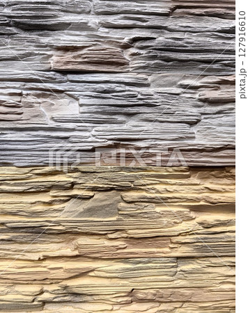 texture layered stone wall with varying colors and shades natural beauty in modern design setting. texture layered stone wall with varying colors and shades natural beauty in modern design setting. 127916610
