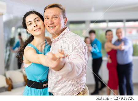 Man and woman dancing 127919726