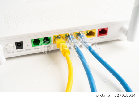 Ethernet cable with wireless router connect to internet service provider internet network. 127919914