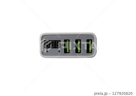 USB adapter for charging multiple mobile phones and modern devices on a transparent background. High quality photo 127920820