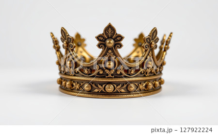 Beautiful ornate crown with intricate designs and golden accents, symbolizing royalty , isolated on white background 127922224