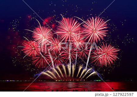 Fireworks celebration and the city night light background. 127922597