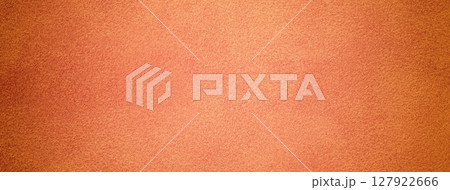 Orange suede fabric background with matte velvet texture, coral and peach tones and soft felt surface in macro 127922666