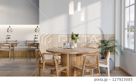 The set of wooden table and chairs next to large glass window in cafe or restaurant. Cosy Interior. The set of wooden table and chairs next to large glass window in cafe or restaurant. Cosy Interior. 127923085