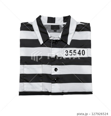 Black and white striped prison uniform shirt, folded with a numerical identification tag 127926524
