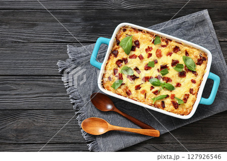 twice baked potato casserole in a baking dish 127926546