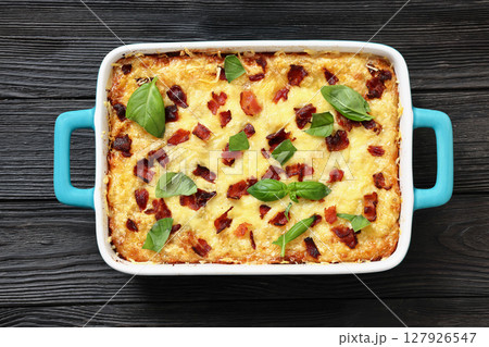 twice baked potato casserole in a baking dish 127926547