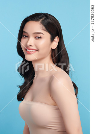 Beautiful Young transgender woman with clean fresh skin on blue background, Face care, Facial treatment, Cosmetology, beauty and spa, transgender women portrait. Beautiful Young transgender woman with clean fresh skin on blue background, Face care, Facial treatment, Cosmetology, beauty and spa, transgender women portrait. 127926562