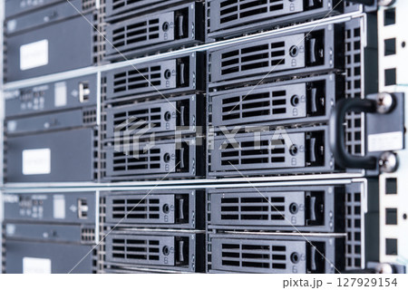 cluster of data storage SSD hard drives inside server rack 127929154