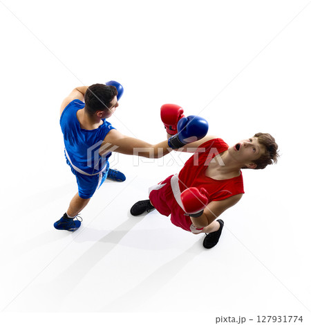Boxing match action shot capturing dynamic punch from above perspective Boxing match action shot capturing dynamic punch from above perspective 127931774