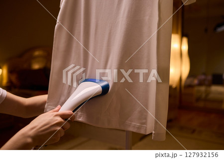 Steam your clothes at home for a fresh and stylish look that's easy to maintain 127932156