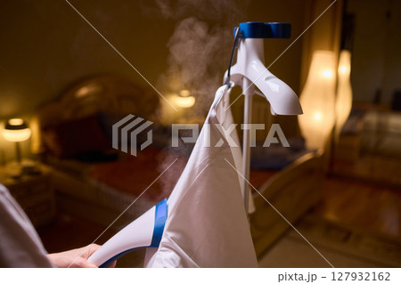 Steam your clothes at home for a fresh and stylish look that's easy to maintain 127932162