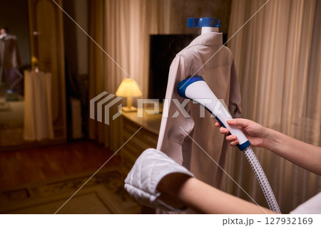 Steam your clothes at home for a fresh and stylish look that's easy to maintain 127932169