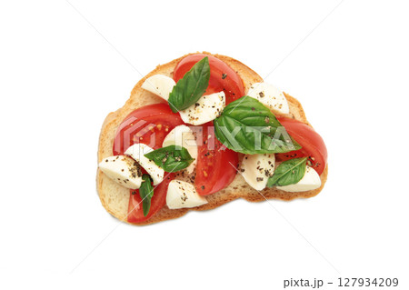 Tasty sandwich with mozzarella cheese, tomatoes and basil isolated on white background. Caprese Tasty sandwich with mozzarella cheese, tomatoes and basil isolated on white background. Caprese 127934209
