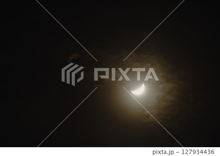 half moon covering by cloud floating on sky in night background 127934436