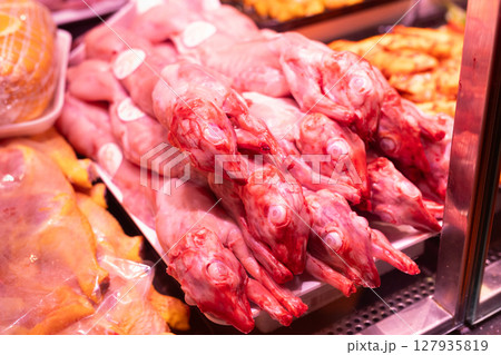 Raw rabbit carcasses on store shelf Raw rabbit carcasses on store shelf 127935819