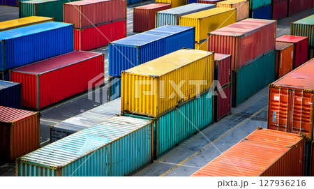 Multi-colored cargo containers on the pier of a cargo logistics port. AI Generated 127936216
