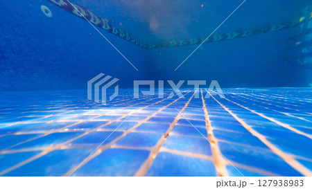 Underwater View of a Swimming Pool Floor with Blue Tiles 127938983