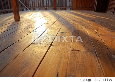 Sunlight Illuminates Wooden Deck Boards with Rustic Charm, Golden Hour on Porch 127941159