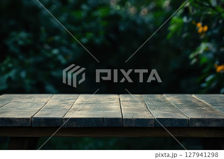Empty Wooden Table Shows Rustic Charm with Lush Green Garden Background, Perfect for Display or Product Placement, Outdoor Living. Empty Wooden Table Shows Rustic Charm with Lush Green Garden Background, Perfect for Display or Product Placement, Outdoor Living. 127941298